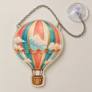 Hot Air Balloon Window Ornament with a hot air balloon with striped panels in coral, teal and gold with a small basket and clouds