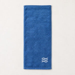 Wave Border Embroidered Bath Towel with three rolling white wave lines embroidered in a compact panel near one end