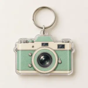Vintage Camera Two-Layer Acrylic Keychain with camera body with a lens ring in mint and cream on the top layer and a plain slightly offset shadow layer behind it, 2-side printed