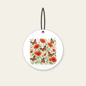 Butterflies Among Poppies Ceramic Ornament in white: Orange-and-black butterflies drift between poppies and tall grasses on a cream ground.