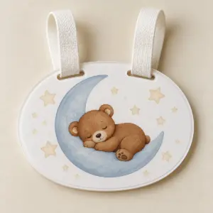 Sleeping Cub Acrylic Stroller Sign with sign face with a sleeping bear cub on a crescent moon in warm brown, cream and blue, 2-layered, White colourway