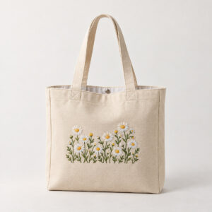 Embroidered Daisy Chain Tote with a small white and yellow daisy chain embroidered above the lower front hem without crossing seams