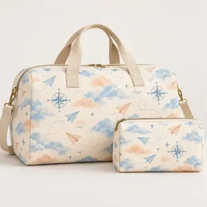 Travel bag set printed with matching clouds, paper planes and a compass rose