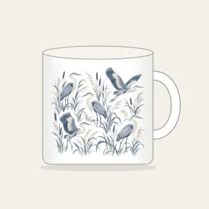 Herons and Reeds in Grey-Blue Mug in white: Herons stand among reeds in grey-blue and cream in an all-over pattern.