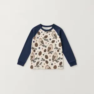 Pinecone Pals Kid Long Sleeve Raglan Pajamas with all-over repeat of pinecones, owls and stars in brown, cream and navy on a long-sleeve raglan top