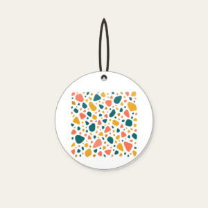 Coral, Teal and Mustard Terrazzo Pebbles Ceramic Ornament in white: All-over terrazzo pebbles in coral, teal and mustard on a cream ground with clear breathing room.