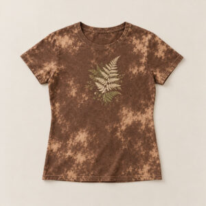 Brown Bleached Women's Fern Tee with compact front chest panel print of a fern frond silhouette in cream and moss, designed to sit quietly on a bleach-effect tee in Brown
