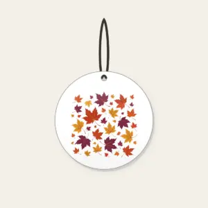 Falling Maple Leaves in Rust and Plum Ceramic Ornament in white: Maple leaves in rust, gold and plum drift across the artwork in an all-over scatter.