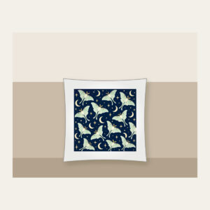 Luna Moths and Crescent Moons on Navy Pillow in white: Pale luna moths and crescent moons glow on deep navy among tiny star dots.