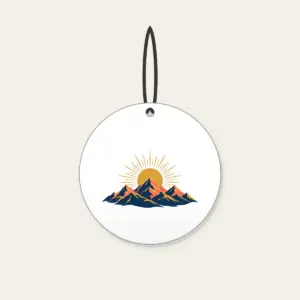 Mountain Range with a Golden Sunrise Disc Ceramic Ornament in white: A mountain range at sunrise with a golden sun disc at the center in navy, coral and gold.