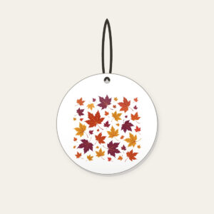 Falling Maple Leaves in Rust and Plum Ceramic Ornament in white: Maple leaves in rust, gold and plum drift across the artwork in an all-over scatter.