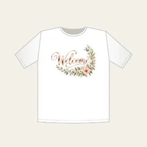 Rose Gold Welcome Wildflower Garland T-Shirt in white: The word “Welcome” in rose gold mirror lettering, with a blush and sage wildflower garland curling into one corner.