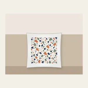 Chip Terrazzo in Terracotta and Navy Pillow in white: An all-over terrazzo of chips in terracotta, sage, navy and cream on a warm white field.