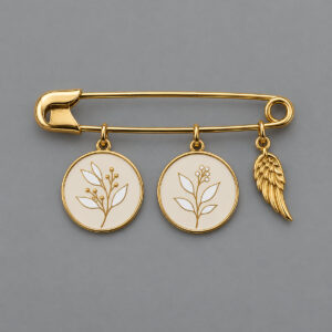 Decorative metal pin with two botanical photo charms and a separate wing accent