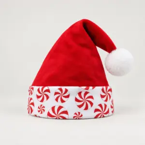 Peppermint Santa Hat with a red hat with a white cuff printed with peppermint swirls in red and white and a pompom