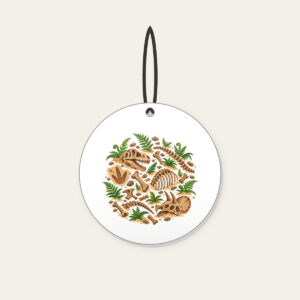 Dinosaur Bones and Fern Dig Scene Ceramic Ornament in white: Dinosaur bones and curling ferns lie scattered across warm sand in earthy brown and green.