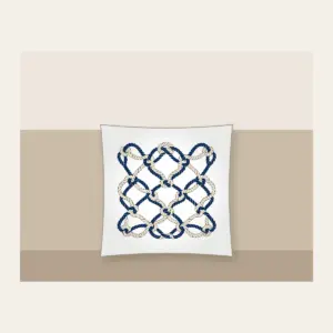 Navy Rope Knot Lines Pillow in white: Rope knot lines weave across the artwork in navy and cream.