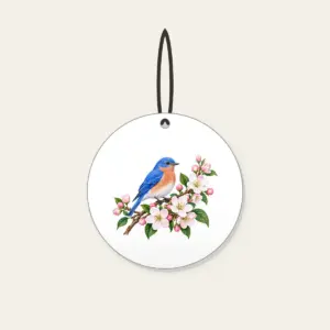 Bluebird on a Blossom Branch Ceramic Ornament in white: A small bluebird rests on a branch of cobalt, white and pale pink blossoms.