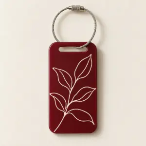 Leafline Keyring Tag with two-sided design: a continuous single-line leaf drawing in cream ink on one side and a small sprig on the other