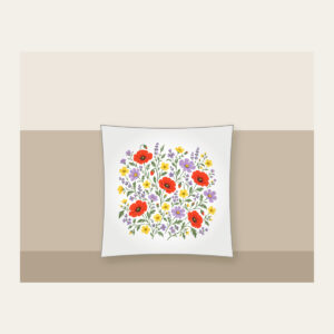 Wildflower Scatter on Sage Pillow in white: Wildflowers in lavender, poppy red and butter yellow scatter over a sage ground.