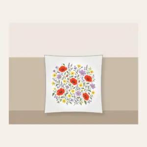 Wildflower Scatter on Sage Pillow in white: Wildflowers in lavender, poppy red and butter yellow scatter over a sage ground.