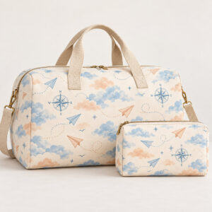 Travel bag set printed with matching clouds, paper planes and a compass rose
