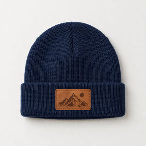 Little Peak Patch Kids Beanie with an engraved mountain peak with a small sun on the patch, single tone