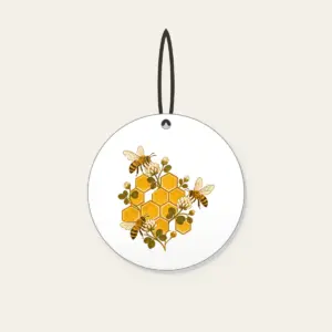 Honeycomb Grid with Bees and Clover Ceramic Ornament in white: A hexagonal honeycomb grid with three small bees and tiny clover blossoms in gold and brown.