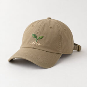 Sprout Embroidered Cap with embroidered seedling with two leaves in green and a small cream soil mound