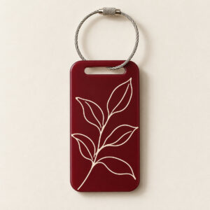Leafline Keyring Tag with two-sided design: a continuous single-line leaf drawing in cream ink on one side and a small sprig on the other