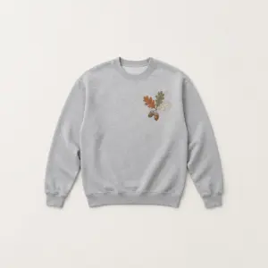 Oak Leaf Classic Sweatshirt with compact chest print of an oak branch with three leaves and two acorns in rust, olive and cream