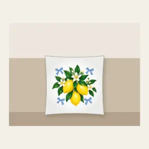 Lemons with Gingham Corners Pillow in white: Bright yellow lemons and deep green leaves on a clean white ground, tucked with small blue gingham accents.