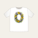 Oval Wildflower Wreath T-Shirt in white: A bold oval wildflower wreath in yellow, purple and green sits at the centre.