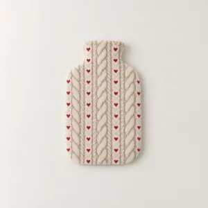 Knit-Look Hearth Bottle Cover with a cable-knit look pattern in oatmeal with tiny red hearts woven between the cables