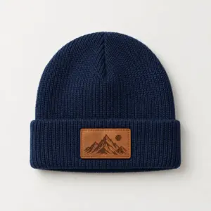Little Peak Patch Kids Beanie with an engraved mountain peak with a small sun on the patch, single tone