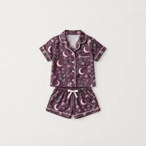 Moon Meadow Kid Satin Pajama Set with all-over crescent moons, wildflowers and tiny stars in plum, mint and cream