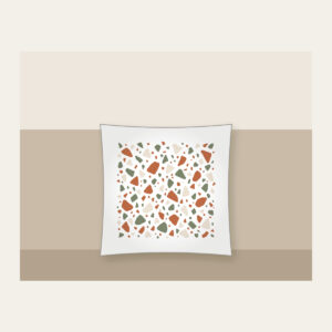 Terracotta and Sage Terrazzo Chips Pillow in white: Terrazzo chips scattered in terracotta, sage and cream.