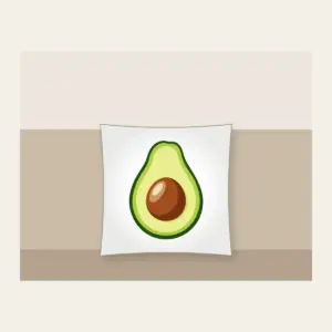 Halved Avocado Study Pillow in white: An avocado cut open in leaf green, with a warm brown pit and a pale cream highlight.