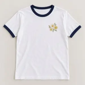Daisy Trio Ringer Tee with small chest print of three daisies with tiny leaves in cream, butter yellow and sage