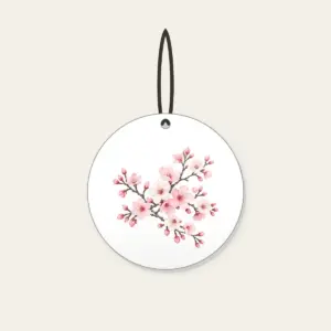 Cherry Blossom Branches on Grey Ceramic Ornament in white: Cherry blossom branches in pale rose and white bloom on a muted grey background.