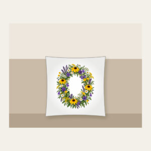 Oval Wildflower Wreath Pillow in white: A bold oval wildflower wreath in yellow, purple and green sits at the centre.