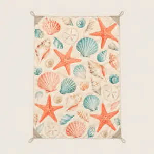 Seashell Scatter Beach Blanket with scattered shells and starfish in coral, cream and teal on a pale sand ground
