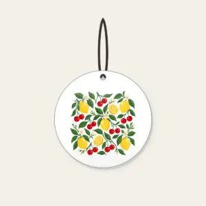 Cherry and Lemon Orchard Pattern Ceramic Ornament in white: Cherries, lemons and leaves in red, yellow and green scattered across a cream field.