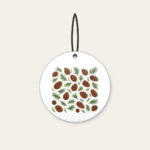 Scattered Pine Cones and Needles Ceramic Ornament in white: Pine cones and needles scatter in brown and green.