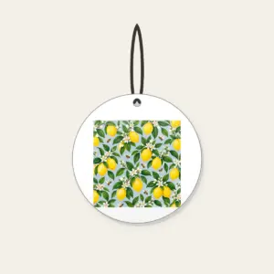 Lemon and Bee Garden Repeat Ceramic Ornament in white: A repeat of lemons, glossy leaves and tiny bees in yellow and green on a pale blue-grey ground.