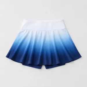 Flared gradient tennis skirt with built-in shorts, printed white to blue to navy
