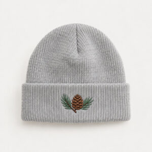 Light Grey Pine Cone Cuffed Beanie with embroidery of a pine cone with two needles in brown and green on the cuff of a Light Grey beanie
