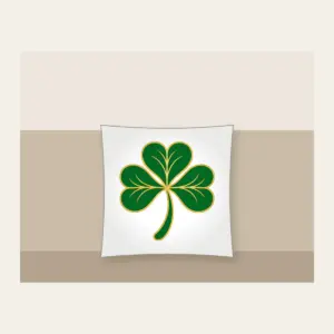 Gold-Edged Clover Leaf Pillow in white: A flat clover leaf in green and gold sits inside a thin border line.