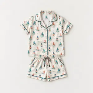 Sailboat Harbor Kid Satin Pajama Set with all-over repeat of tiny sailboats and harbour lanterns in teal, coral and cream
