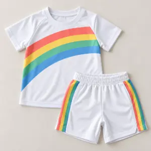 Rainbow Goal Kids Soccer Set with a rainbow arc in coral, yellow, green and blue across the jersey chest and a matching stripe down the shorts